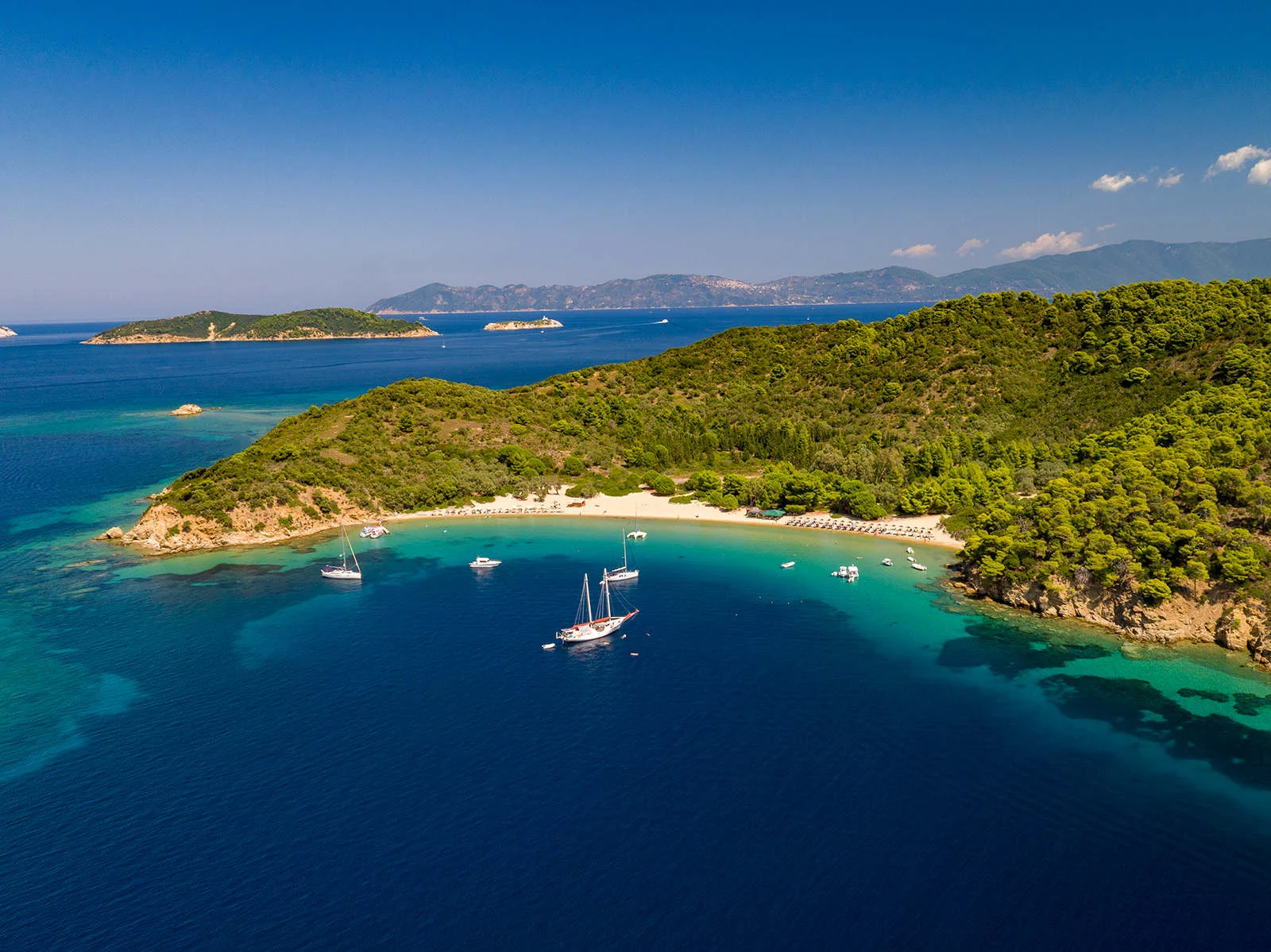 Blue water and sheltered coastline in Skiathos